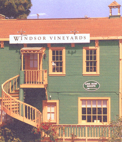 The original building and tasting room for Windsor Vineyards - a green building with stairs leading up to the tasting room