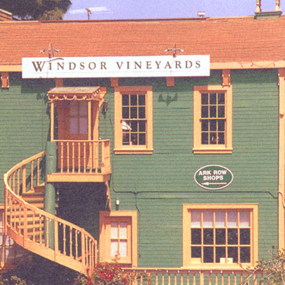 The original building and tasting room for Windsor Vineyards - a green building with stairs leading up to the tasting room