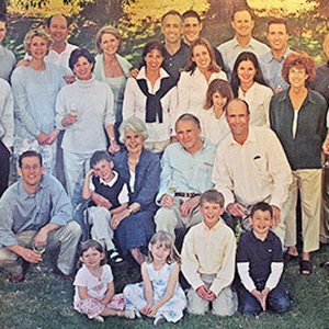 In 1989 the Klein family stands smiling in a large group on a dark green lawn