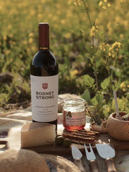 Rodney Strong wine bottle outside with food