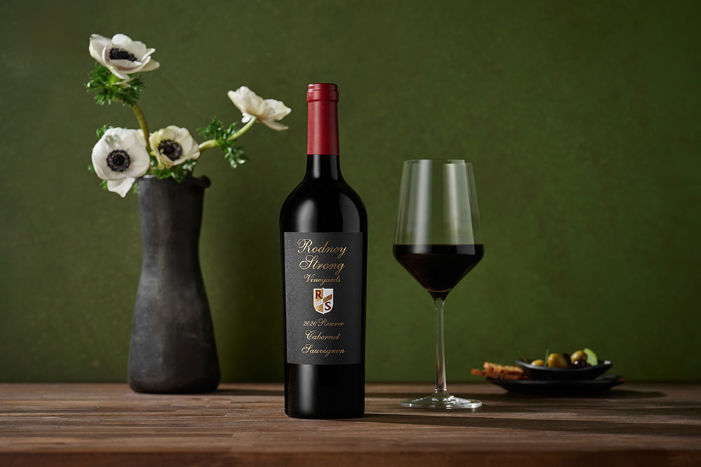 Reserve Cabernet Sauvignon with wine glass and flower vase