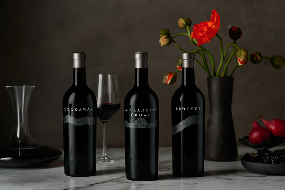Single Vineyard Tier Wines with decanter and red flowers