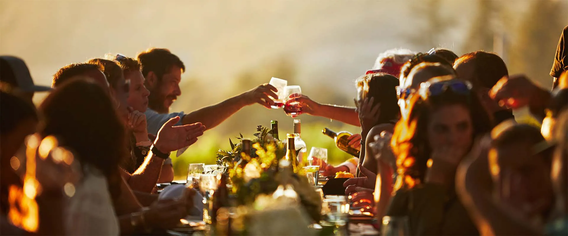 Group of people enjoying a sunset dinner at Rodney Strong Vineyards