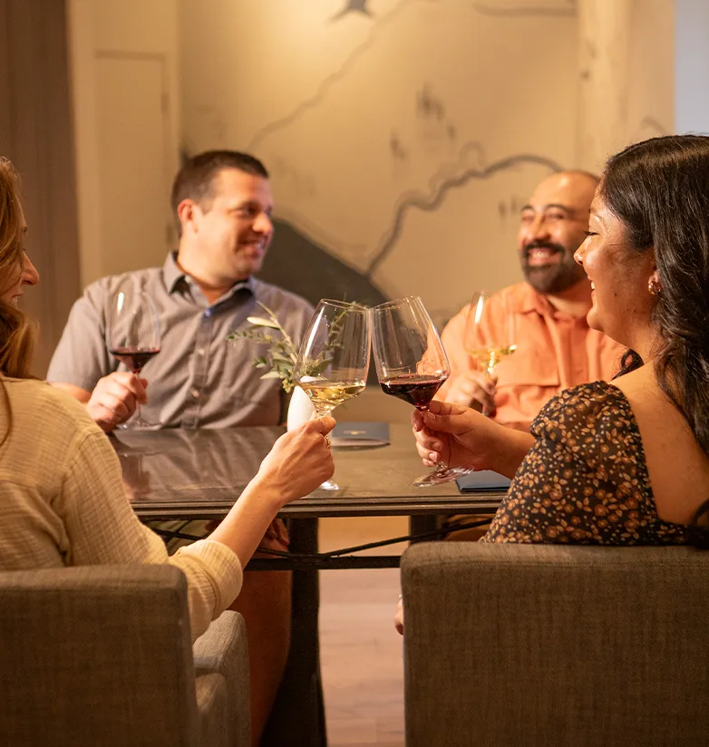 People enjoying wine in the tasting room